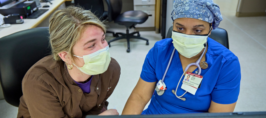 nurses look at screen