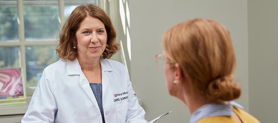 Dr. Glowacki speaking with a patient