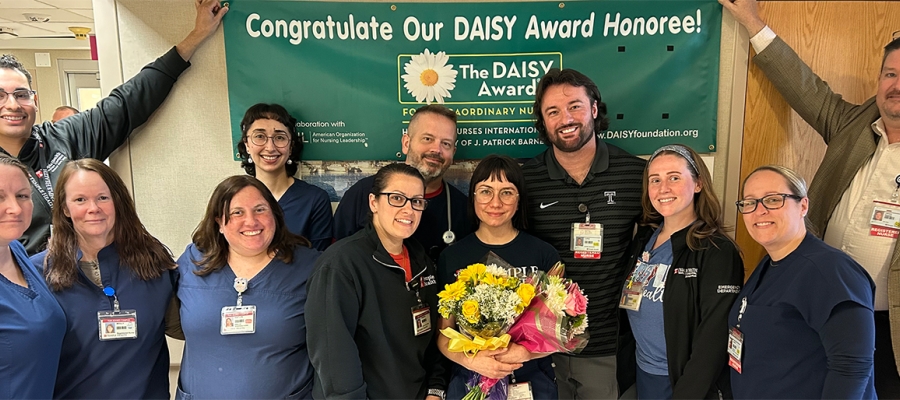Group of healthcare providers celebrating DAISY award recipient