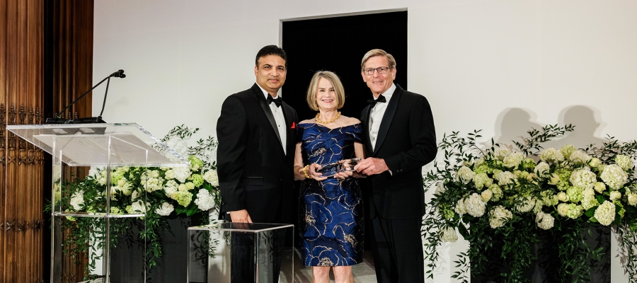 Abhi Rastogi presenting the 2026 Diamond Award to Leigh and John Middleton