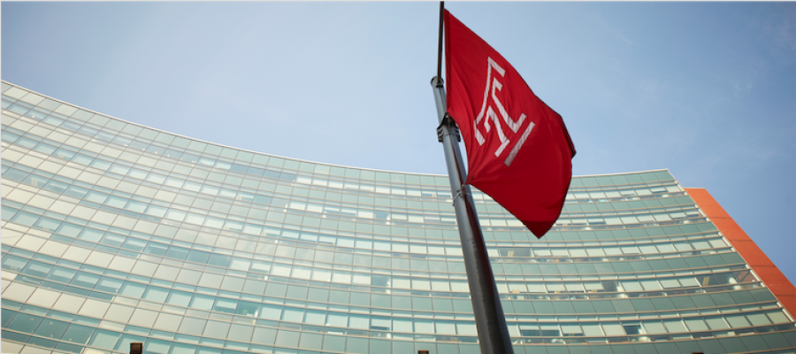 Temple flag in front of Temple University Medical Education and Research Building