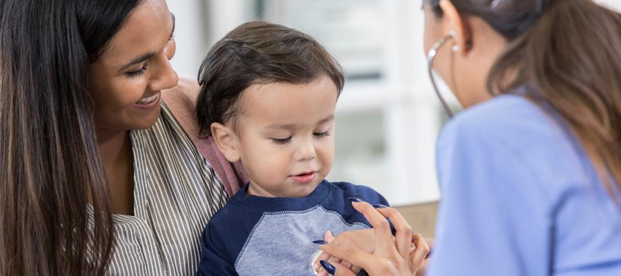 Pediatrician with a young child