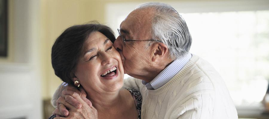 Elder husband kissing his wife