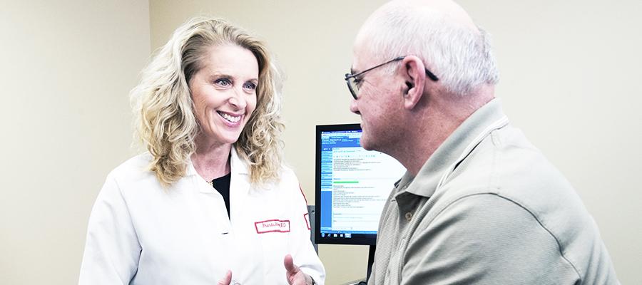 Gastroenterologist consulting with patient