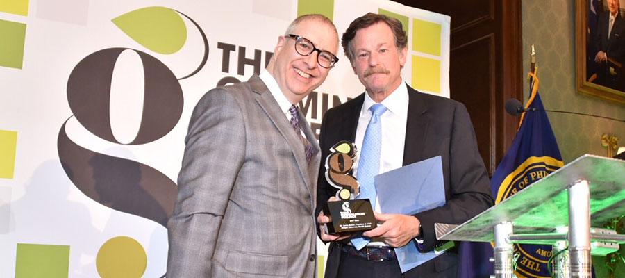 Larry Kaiser on stage with Germination Project ICON Award