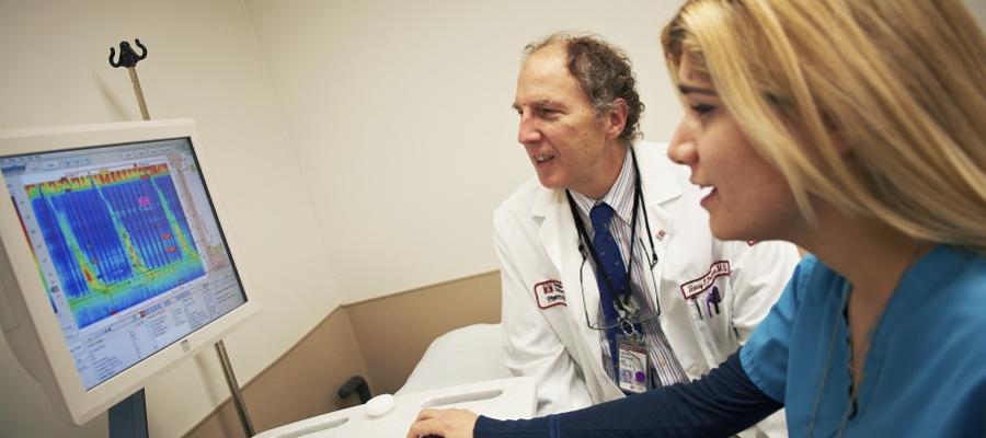 Physician with nurse reviewing data