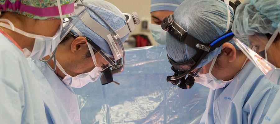 Closeup of Yoshiya Toyoda performing surgery