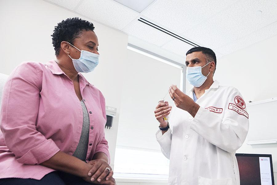 Dr. Kartik Shenoy examining a pulmonary patient