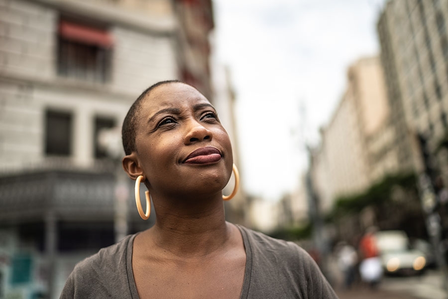 Woman looking up thinking