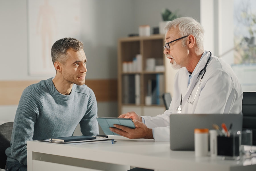 Man talking with his doctor