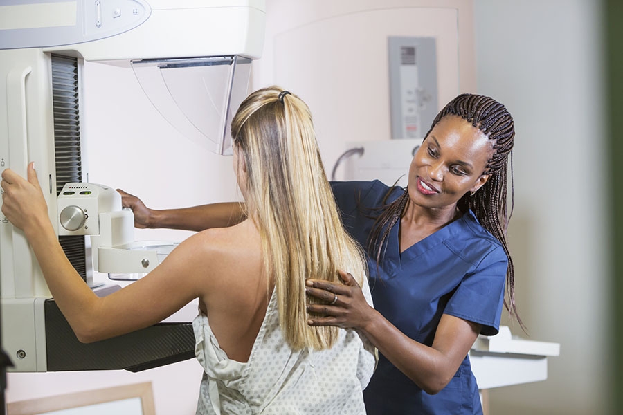 Woman receiving mammogram