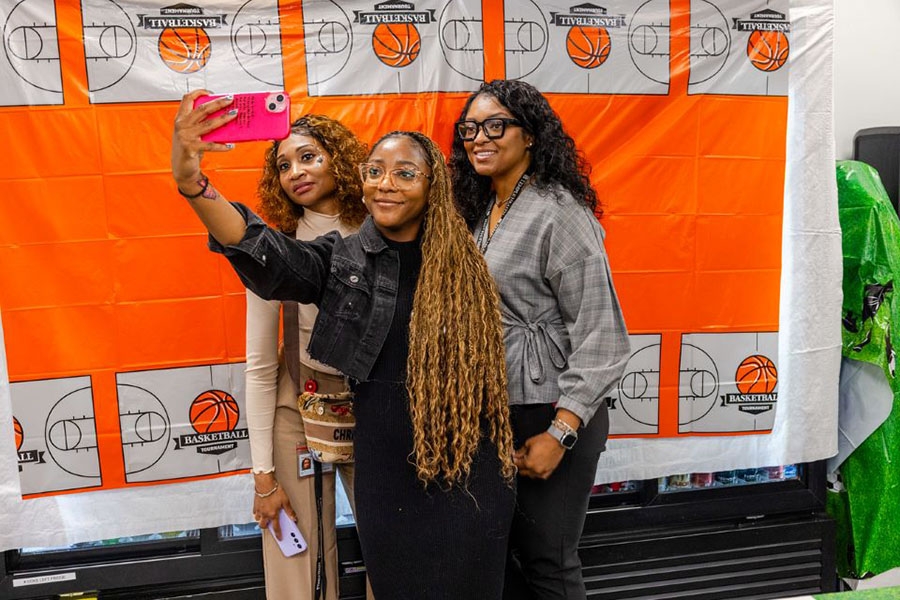 Team members stop to take a selfie at Episcopal.