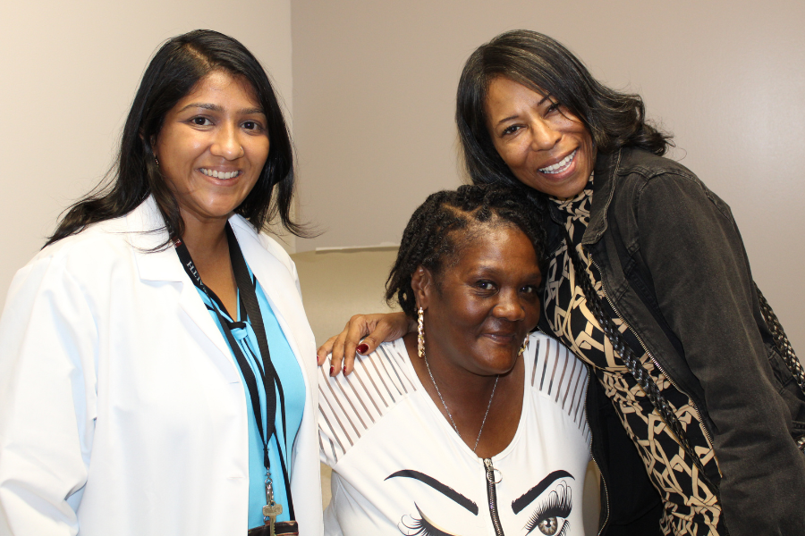 Dr. Shah Pandya (left) and MVP-CAN Navigator Bryant (right) with an MVP-CAN patient (center).