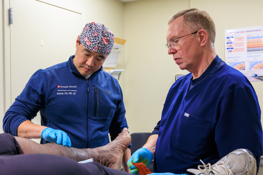 Dr. Kenny Oh (left) and Wound Care Center nurse Ken Fitzgerald, RN, WCC (right) assess the extent of a patient's healing.