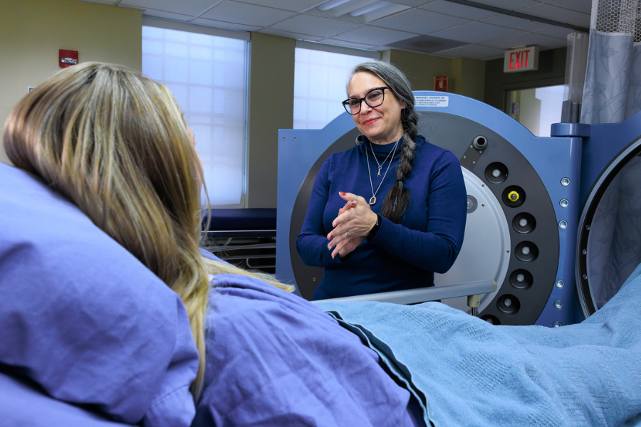 Jennifer Parilo, BSN, RN, CWOCN, the Wound Care Center’s Program Director, speaks with a patient.
