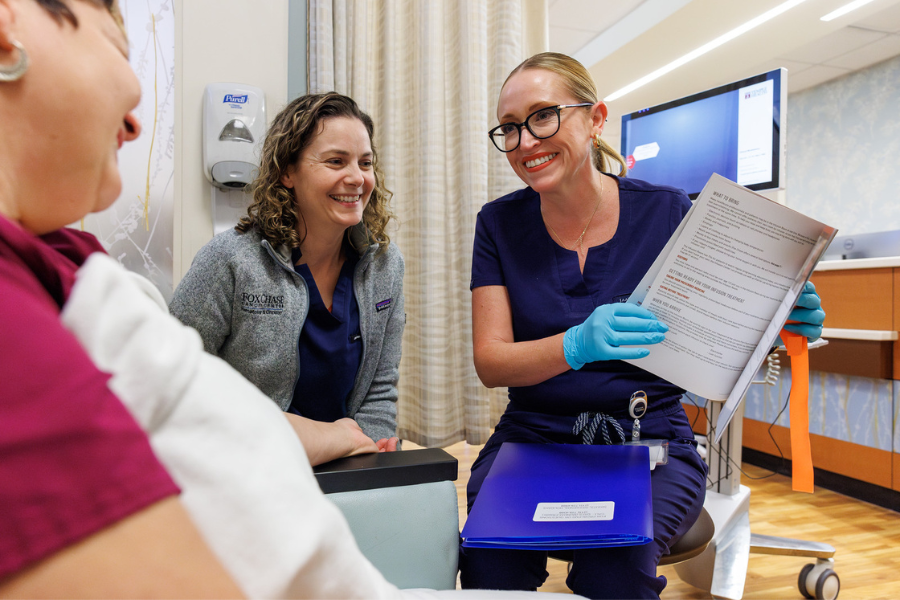 Nightingale Award finalist and Clinical Practice Lead Caitlin Fanning shows a patient health education materials.