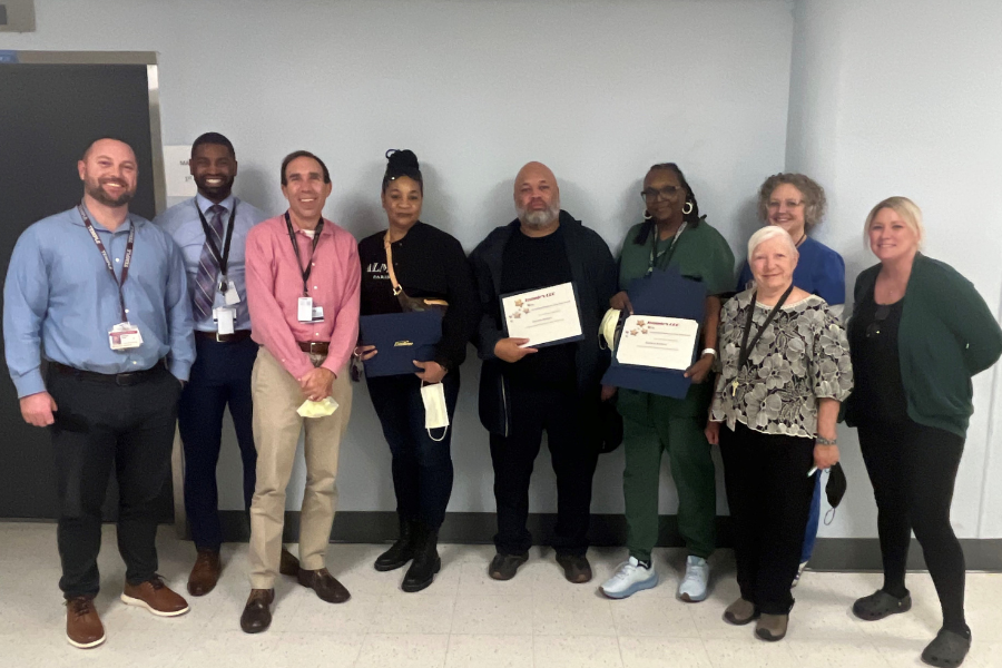 Dumas celebrates earning the DAISY Award with his colleagues. 