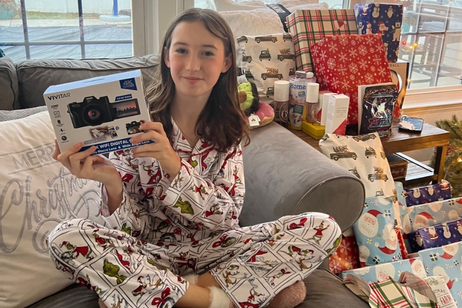 Gavin’s sister, Grace, with one of her presents: a new camera!