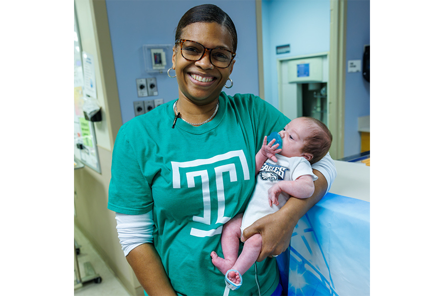 This NICU team member was all smiles for this adorable moment!