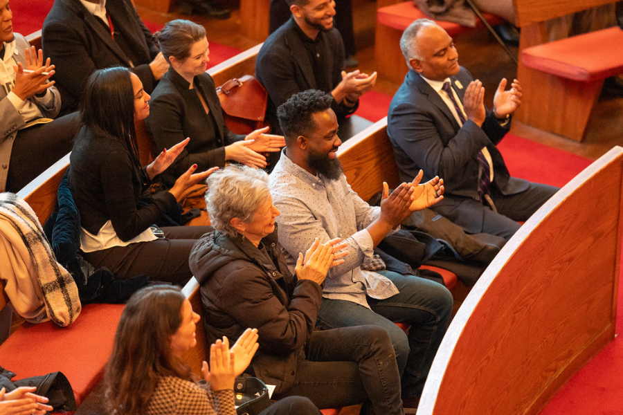 Attendees (including Pennsylvania State Representative Danilo Burgos, far right) enjoy remarks from the ceremony's speakers.