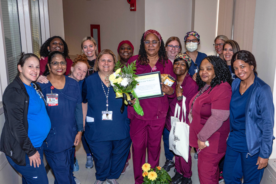 Marie-ann’s colleagues gather to honor her achievement.