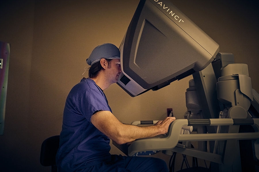 Dr James operating robot console