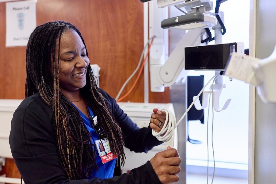 Nurse wrapping blood pressure cuff