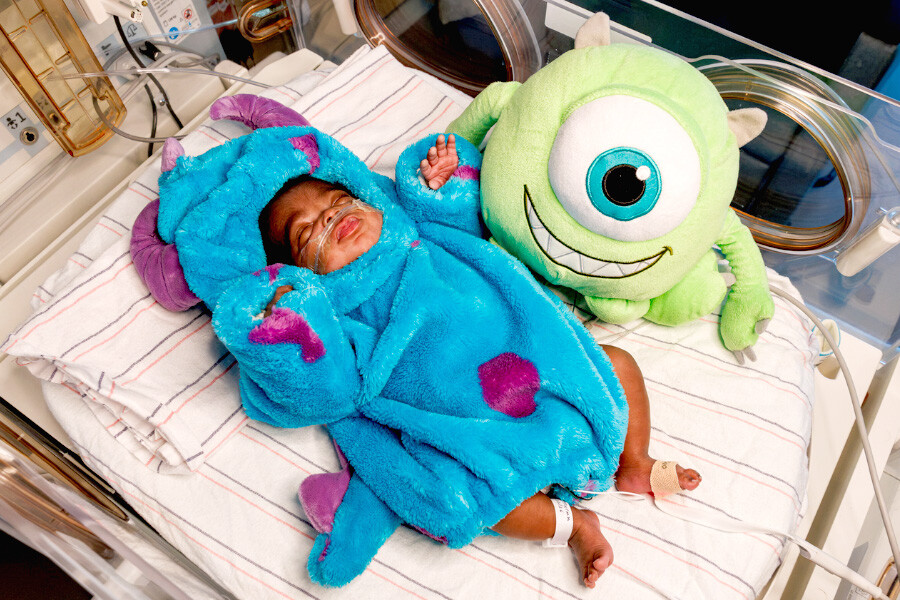 Newborn baby in monster costume