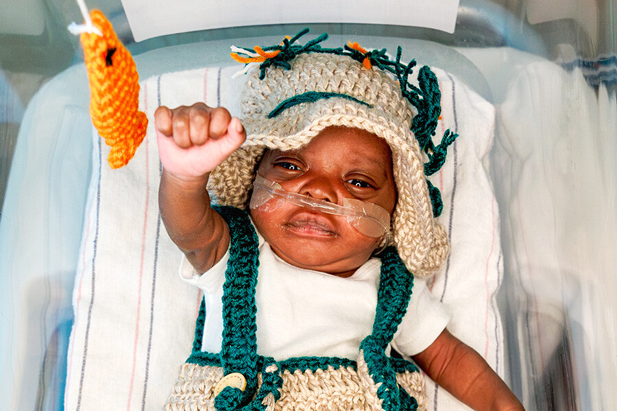Newborn baby in fishing costume