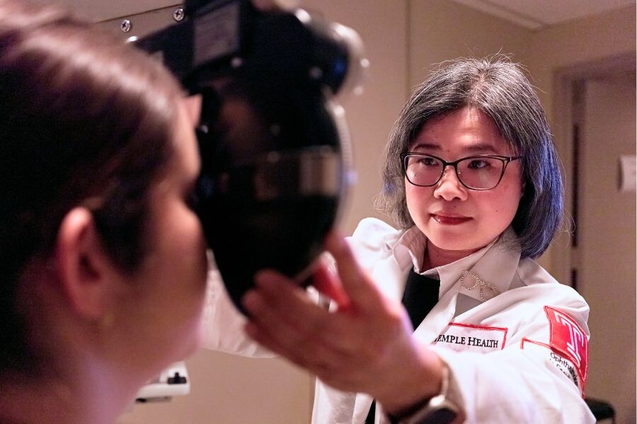 Ophthalmologist performing exam 
