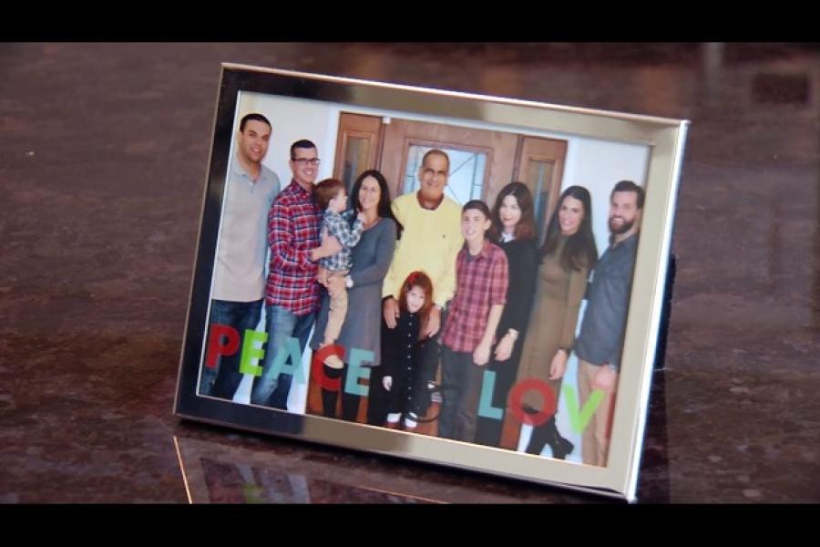 Picture in picture frame on table of Temple patient, Frank, and his family