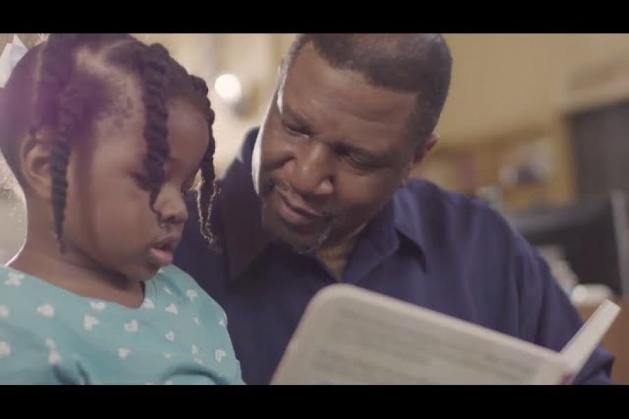 Temple heart transplant patient, Elroy, reading to his granddaughter