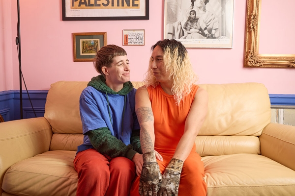 Chaska on the couch with her partner