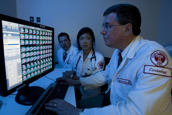 Cardiovascular imaging specialist William Van Decker reviewing results