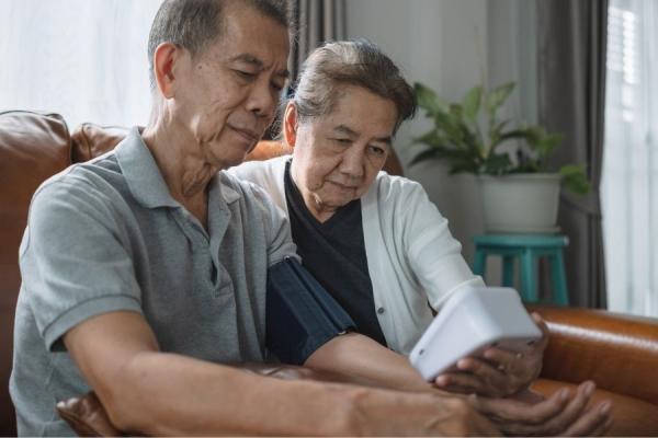 Patient checking his blood pressure at home