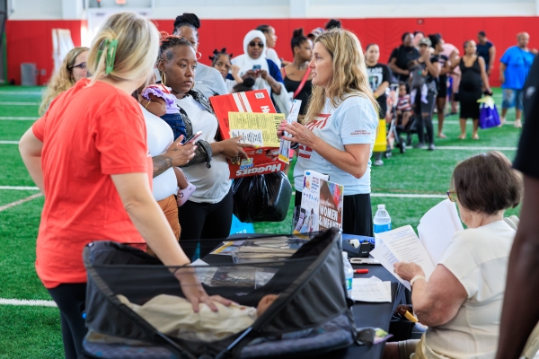 Kim Hanson, VP and Chief Nursing Officer of the Temple Women & Families Campus, provides free diapers and education materials to parents and caregivers at the Community Baby Shower.