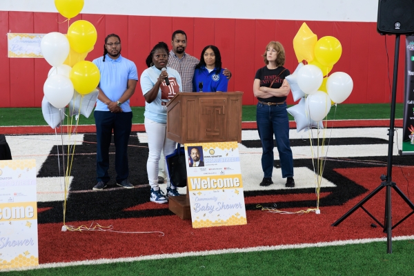 Lakisha Sturgis, Director of Community Care Management for Population Health, delivers remarks to Community Baby Shower attendees.