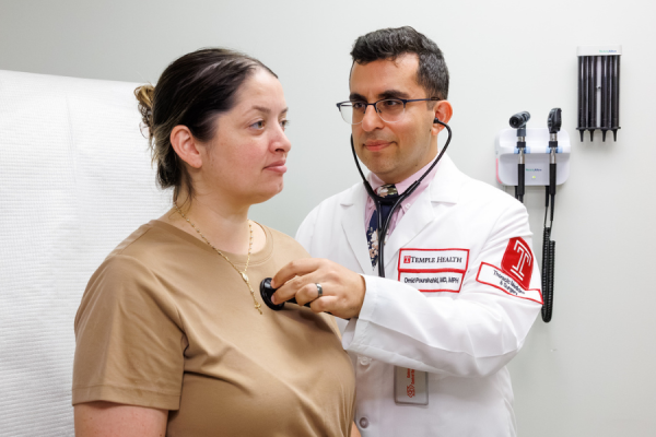Dr. Pourshahid examines a patient.