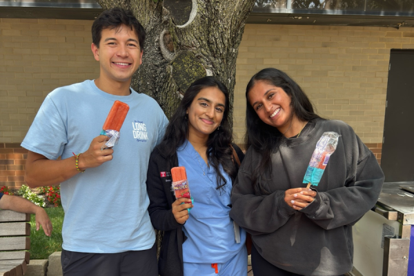 Team members enjoying sweet treats outside TUH-Main Campus.