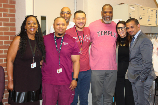Receptionist/Scheduler Markus Rodriguez (center) celebrates his TFP C.A.R.E.S. Award with his colleagues.