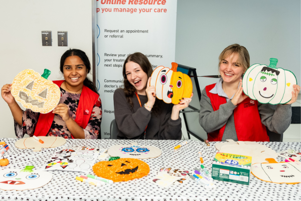 Office of Patient Experience volunteers with their pumpkins
