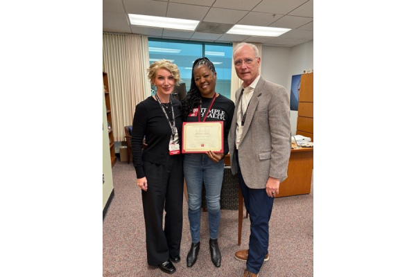 Edoris Lomax (center) with Population Health leaders Meaghan Kim, MHA, BSN, RN, CDCES (left) and Steven R. Carson, MHA, BSN, RN (right).