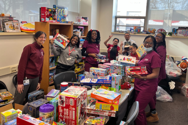 Temple Pediatrics residents and team members unpack donations.