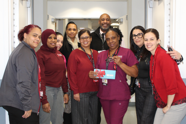 TFP C.A.R.E.S. Award winner Shawnda Southerland (center right) celebrates her achievement with team members.