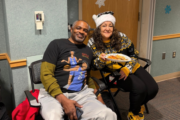 Loughran with SOAR member Allen at the 2025 SOAR holiday party.