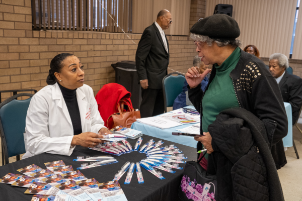 A community member learns about services available at Temple University’s Maurice H. Kornberg School of Dentistry.