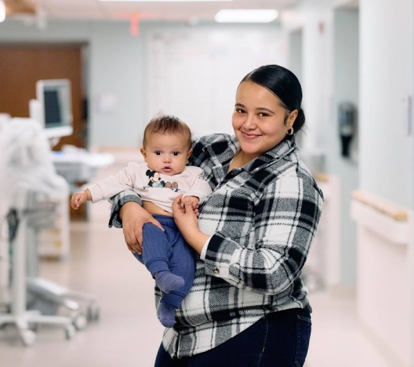Juliet holding her newborn on the hospital’s first day.