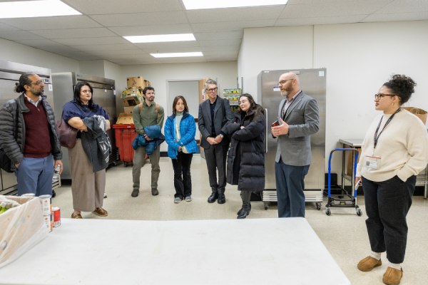 Patrick Vulgamore, Director of Temple Health’s Addiction Medicine Service Line, gives collaborative members a tour of Episcopal’s Food Pantry.