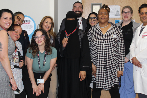 Amara McFarland (center) celebrates her award with colleagues.