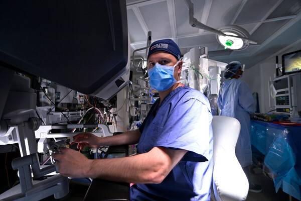 Doctor looking at camera while preforming excellent care
